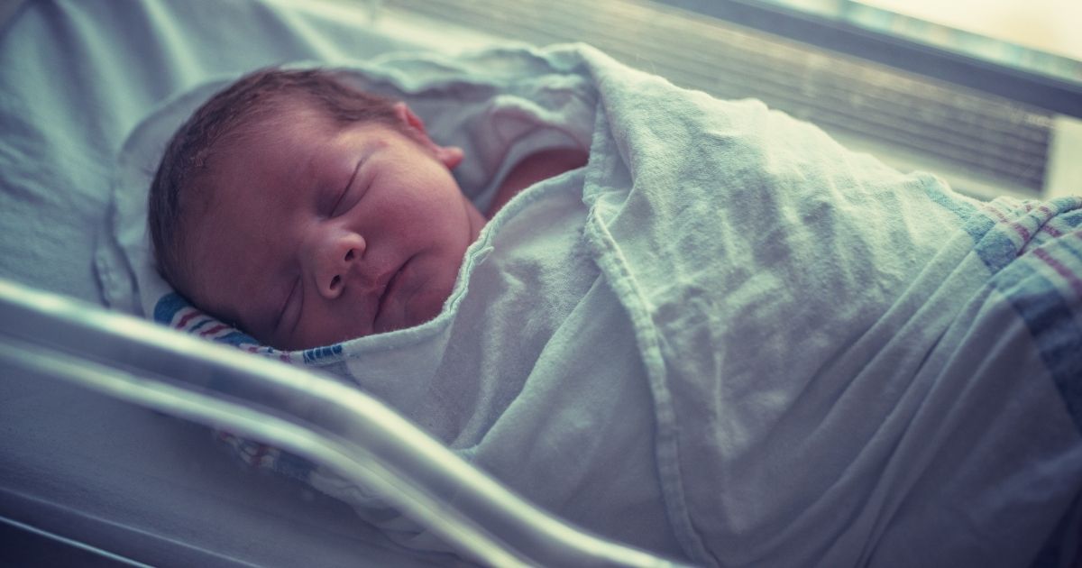 This stock photo portrays a newborn baby boy sleeping in a hospital bed. A baby boy born to Brittany Lane in April was initially pronounced dead following several complications with the birth.