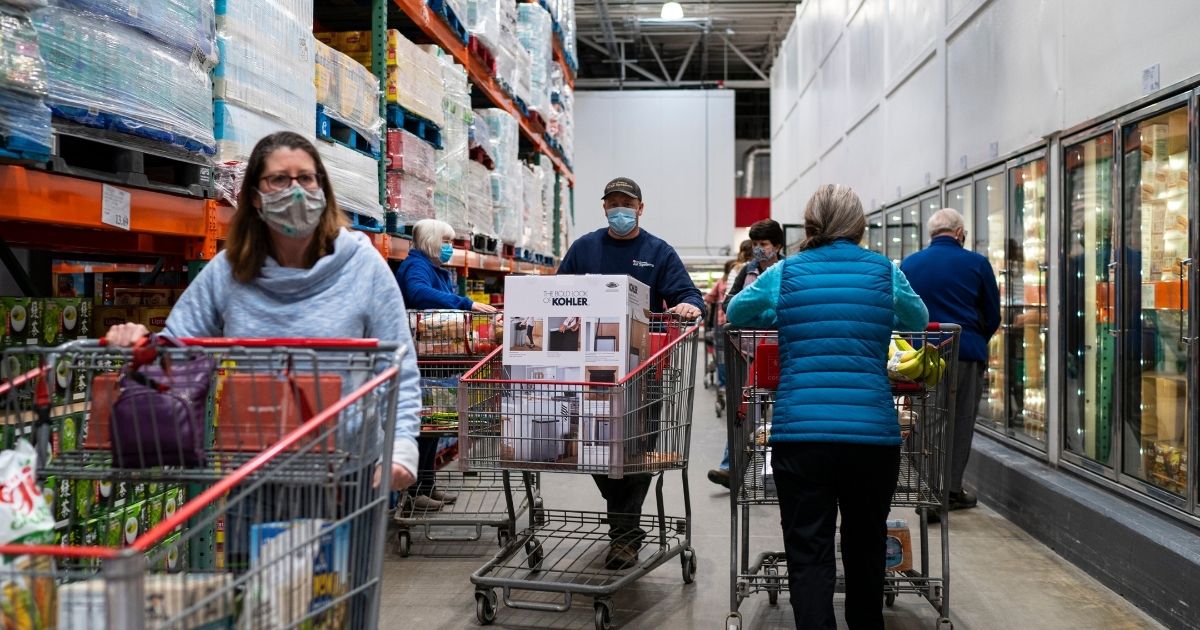 Shoppers search for items at a Costco store on Feb. 26, 2021, in Colchester, Vermont.
