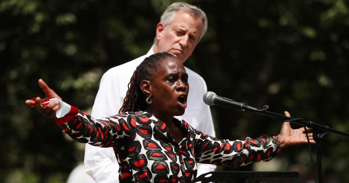 New York Mayor Bill de Blasio listens as his wife, Chirlane McCray, speaks in Brooklyn’s Cadman Plaza Park on June 4 during a memorial service for George Floyd, who died in Minneapolis police custody on May 25.