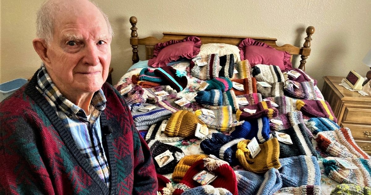 Pictured above is Tom Cornish, 96, who has knitted 400 hats for the Salvation Army.