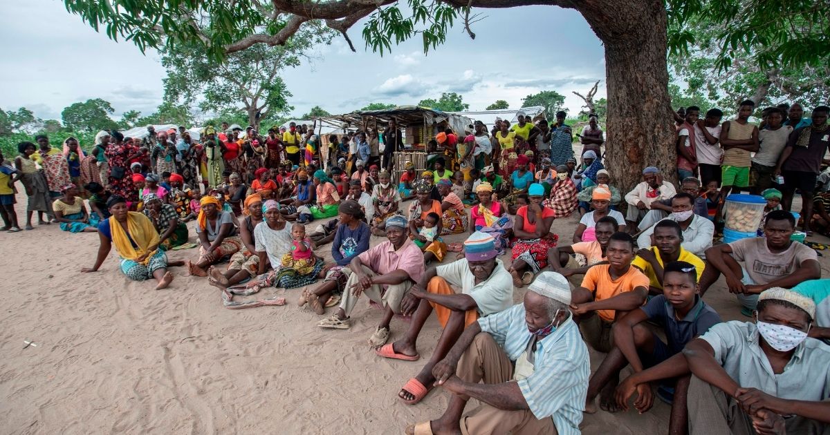 Displaced people gather for a community meeting in Matuge, northern Mozambique, on Feb. 24, 2021. (