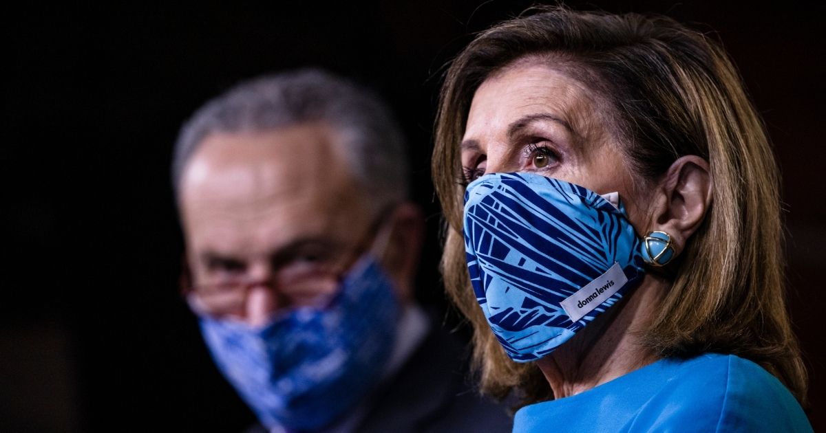 Speaker of the House Nancy Pelosi speaks alongside Senate Minority Leader Chuck Schumer during a joint news conference at the US Capitol on Nov. 12, 2020, in Washington, D.C.