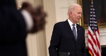 President Joe Biden listens to a question from a reporter after forgetting to put on a mask when he left the podium following remarks on the state of coronavirus vaccinations at the State Dining Room of the White House in Washington on Tuesday.