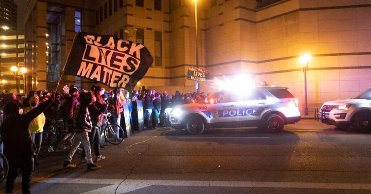 Black Lives Matter activists confront Columbus police outside of Columbus police headquarters during a protest in reaction to the shooting of Makiyah Bryant on Tuesday in Columbus, Ohio.