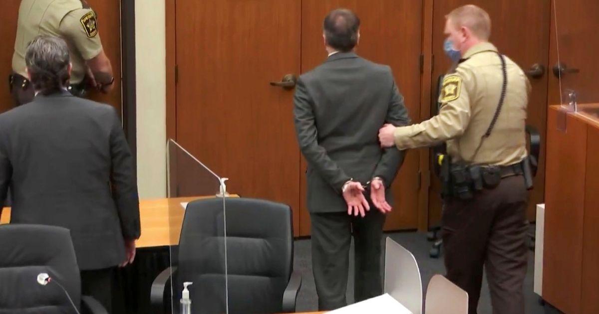 Derek Chauvin, center, is taken into custody as his attorney, Eric Nelson, left, looks on after the verdicts were read at Chauvin's trial in the 2020 death of George Floyd on April 20 at the Hennepin County Courthouse in Minneapolis.