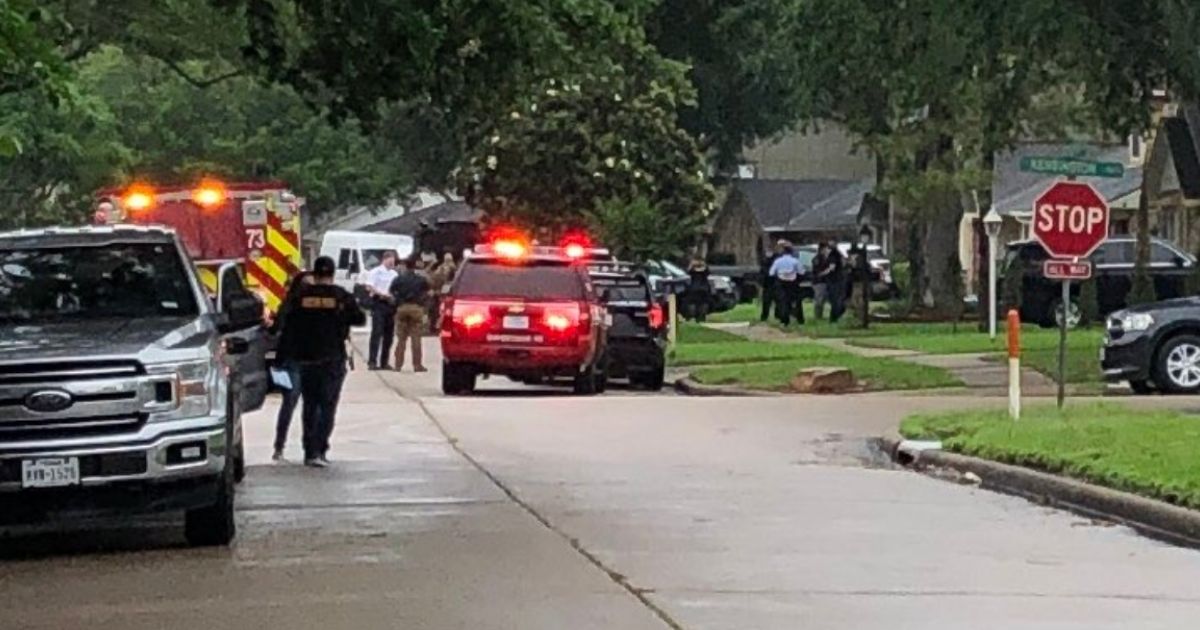 Houston Police investigate the home where over 90 people were discovered inside in an apparent human smuggling scheme.