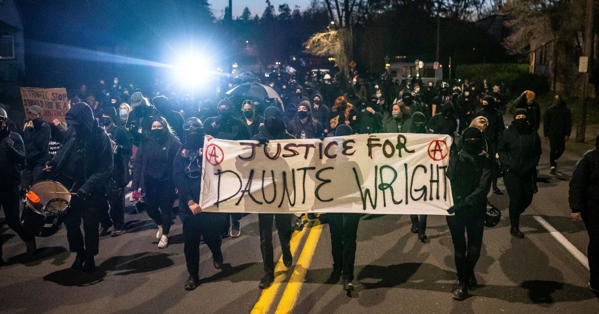 Activists march towards the Multnomah County Sheriff's office during a protest against the killing of Daunte Wright on Monday in Portland, Oregon.