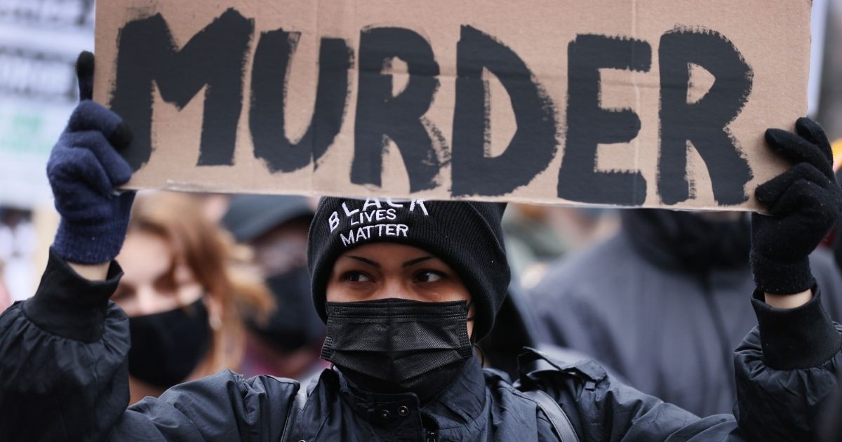 A demonstrator protests near the Hennepin County Courthouse on Monday in Minneapolis.