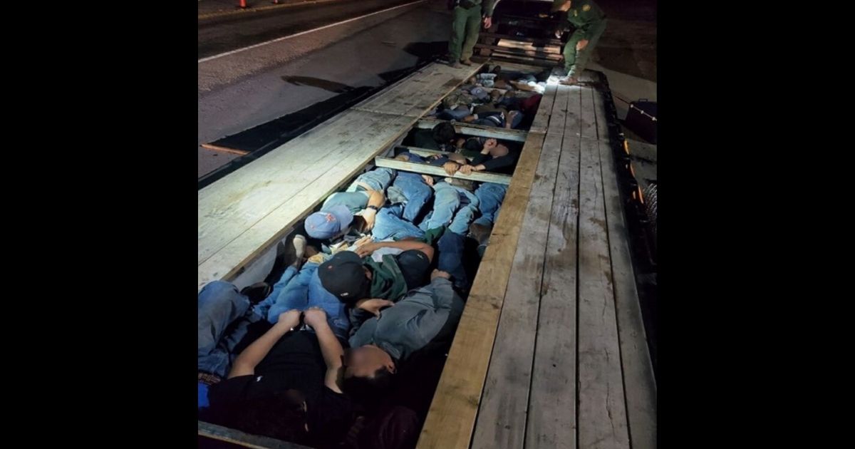 Chief Patrol Agent Austin Skero tweeted photos on Tuesday of 20 illegal immigrants Border Patrol agents discovered packed under the floorboards of a trailer.