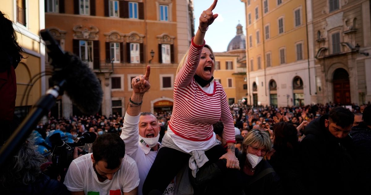 Protesters gather outside the lower Chamber during a protest by restaurant and other business activity owners in Rome, Italy, on Tuesday.