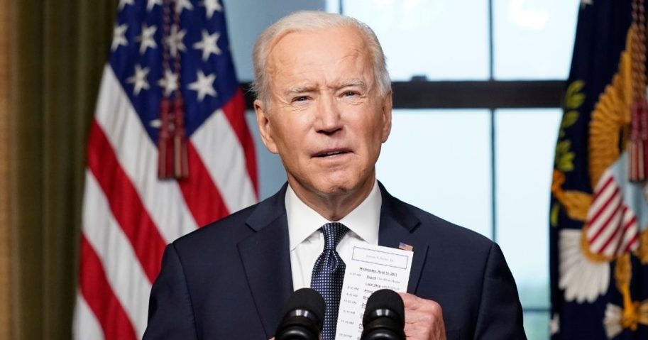 President Joe Biden pulls a notecard from his pocket as he speaks from the Treaty Room in the White House about the withdrawal of U.S. troops from Afghanistan on April 14, 2021, in Washington, D.C.
