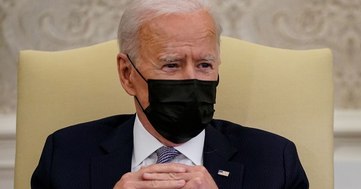 President Joe Biden meets with members of Congress in the Oval Office of the White House in Washington on April 12.