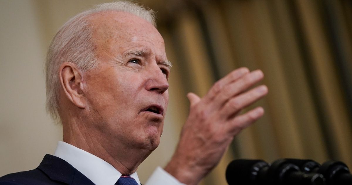 President Joe Biden speaks in the State Dining Room of the White House in Washington on Friday.