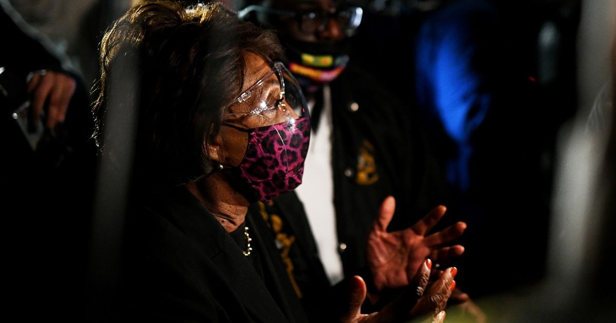 Democratic Rep. Maxine Waters of California joins demonstrators in a protest outside the Brooklyn Center police station on Saturday in Brooklyn Center, Minnesota.