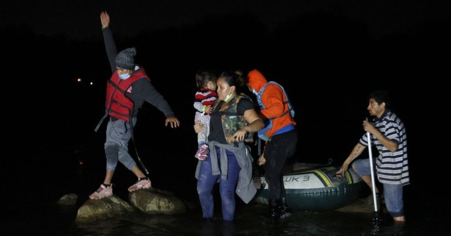A group of migrants arrives in the U.S. after crossing the Rio Grande in a raft piloted by smugglers on March 30 in Roma, Texas.