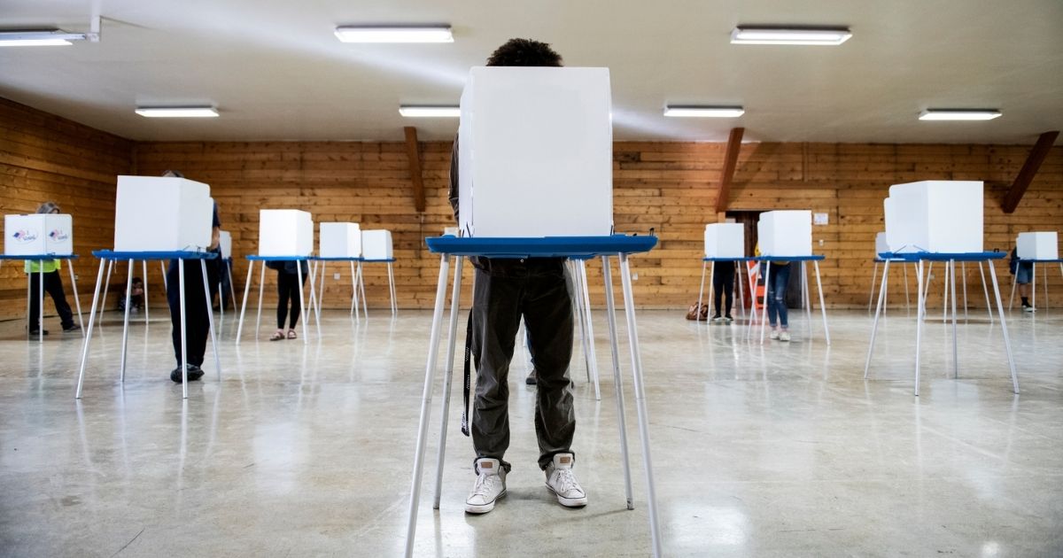 Voters fill out their ballots at the Gallatin County Fairgrounds in Bozeman, Montana, on Nov. 3.