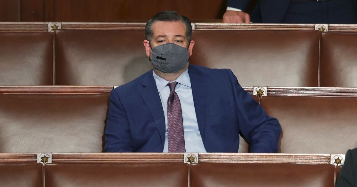 Republican Sen. Ted Cruz of Texas listens as President Joe Biden speaks to a joint session of Congress on Wednesday in the House Chamber at the U.S. Capitol in Washington, D.C.