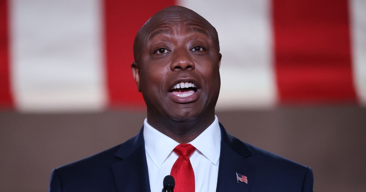Republican Sen. Tim Scott of South Carolina stands on stage while addressing the Republican National Convention at the Mellon Auditorium on Aug. 24, 2020, in Washington, D.C.