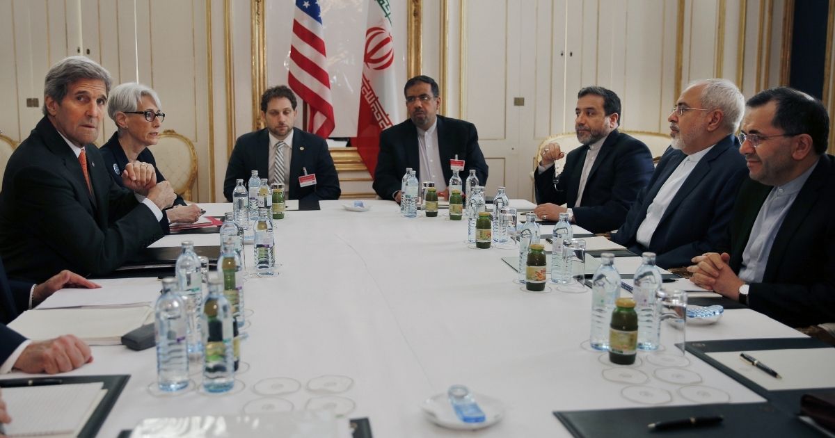 An American negotiating team led by then-Secretary of State John Kerry meets with an Iranian team in 2015 in Vienna.