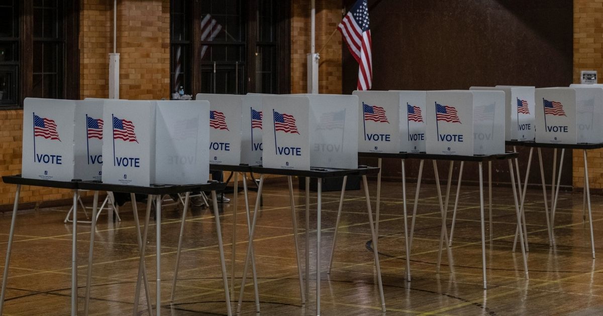 Rows of voting booths are seen in Flint, Michigan, at the Berston Fieldhouse polling place on Nov. 3, 2020.