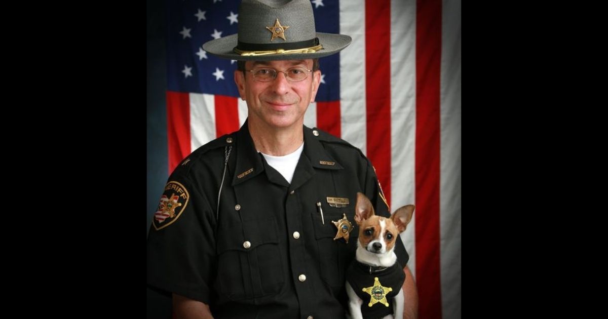 This 2006 image shows then-Sheriff Dan McClelland and his police dog Midge. Both died on Wednesday.