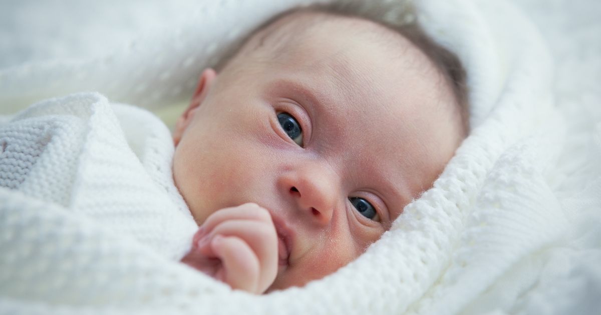 An infant is seen in the above stock image.
