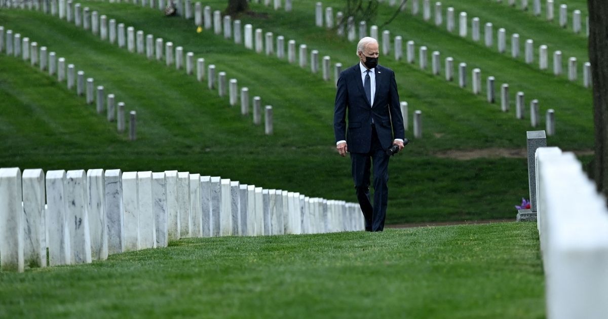 President Joe Biden walks through Arlington National Cemetery in Arlington, Virginia, on Wednesday.