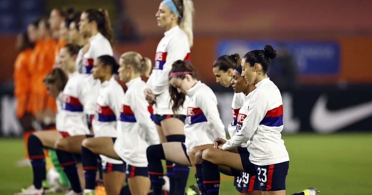 American soccer players kneel before an international friendly match between the Netherlands and the United States on Nov. 27, 2020, in Breda, the Netherlands.