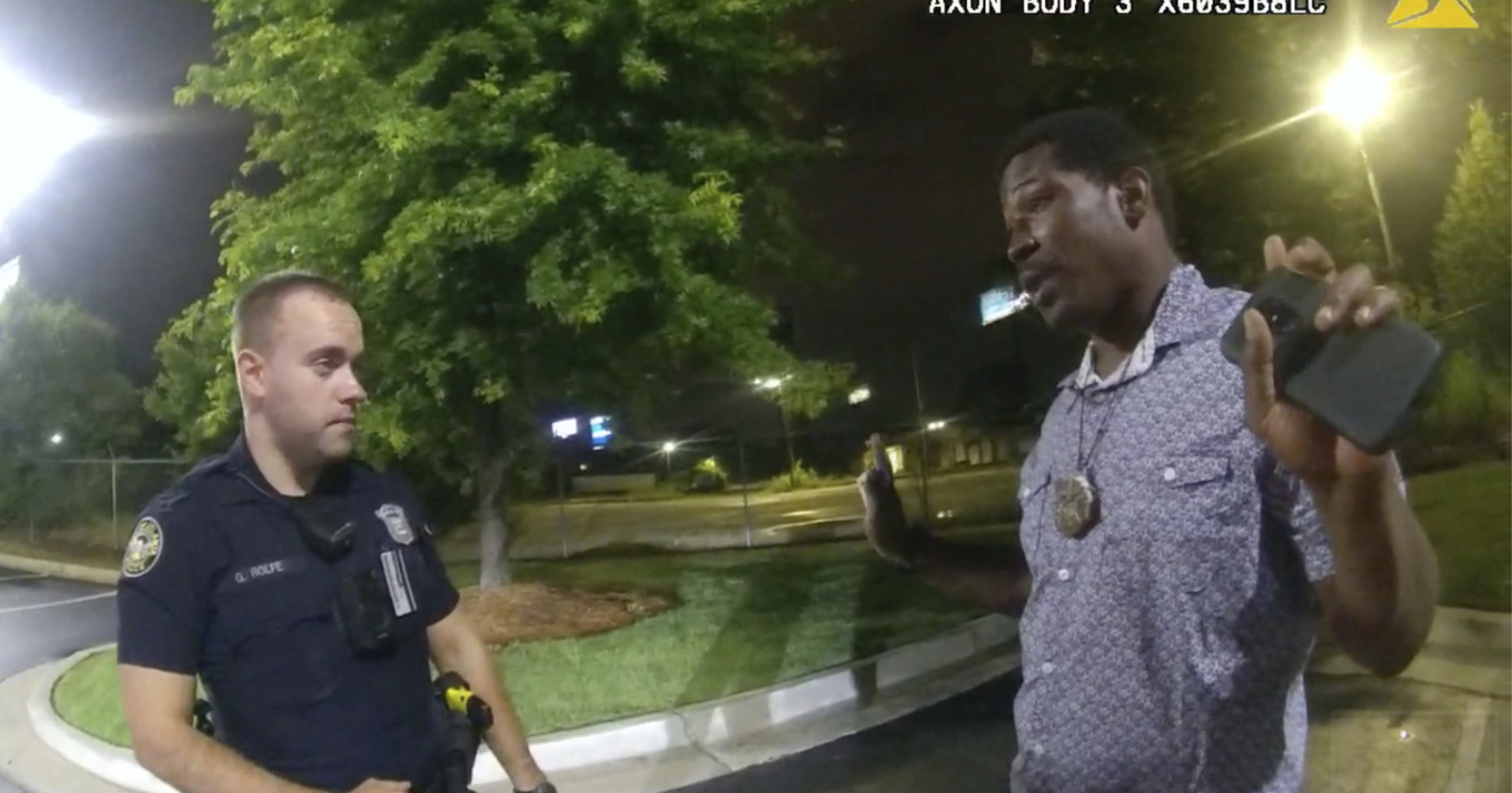 Rayshard Brooks, right, speaks with officer Garrett Rolfe, left, in the parking lot of a Wendy's restaurant in Atlanta on June 12, 2020, in this image taken from body camera video.