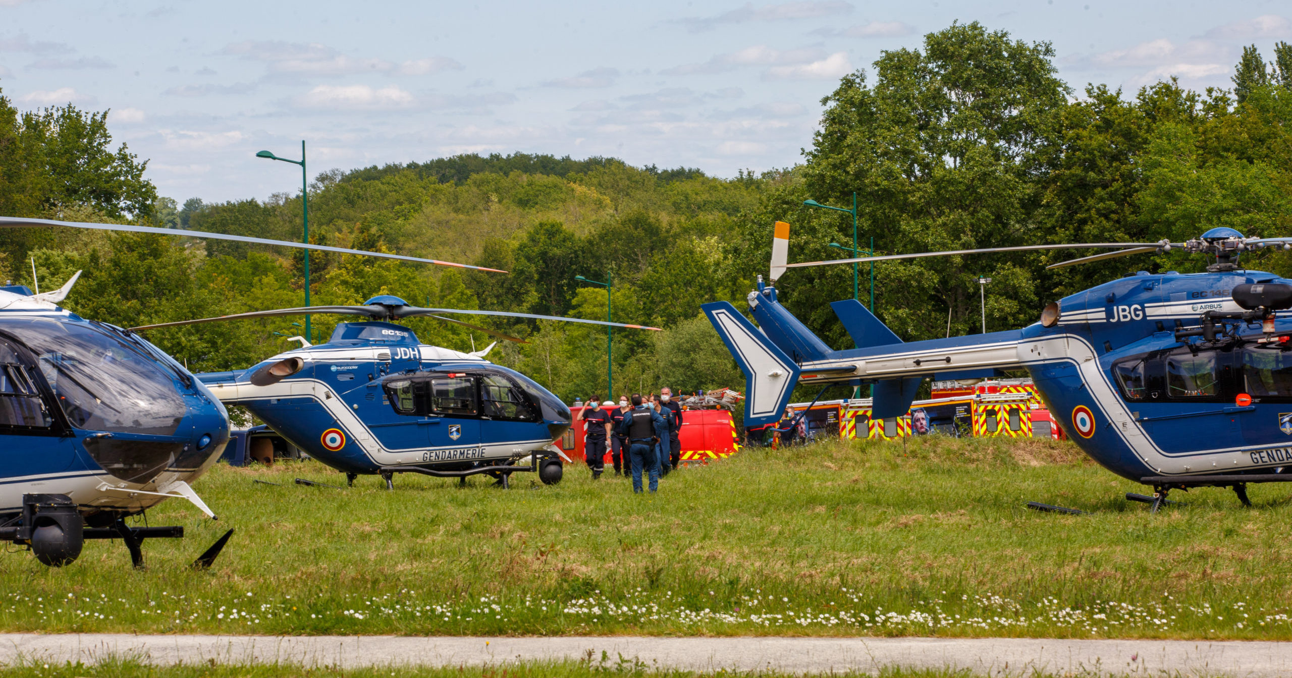 French gendarmes and firemen stand near helicopters in La Chapelle-sur-Erdre, France, on Friday.