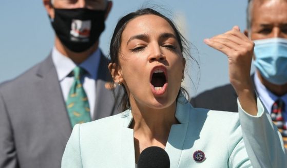 Democratic Rep. Alexandria Ocasio-Cortez of New York speaks during a press conference to re-introduce the Green New Deal in front of the U.S. Capitol in Washington, D.C., on April 20, 2021.