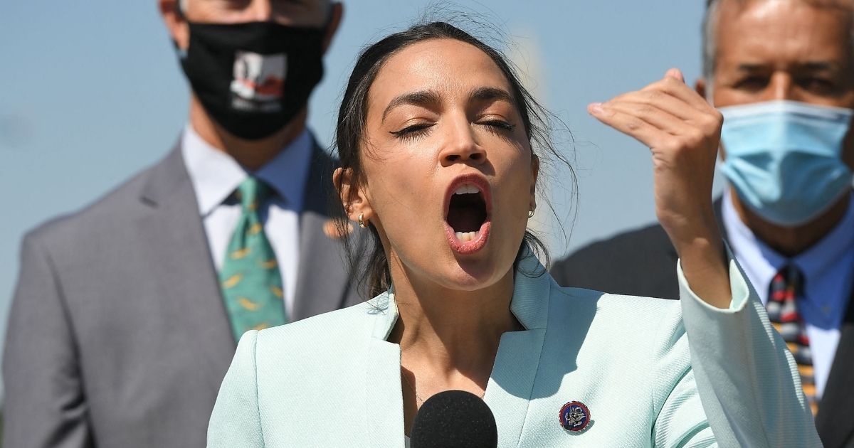 Democratic Rep. Alexandria Ocasio-Cortez of New York speaks during a press conference to re-introduce the Green New Deal in front of the U.S. Capitol in Washington, D.C., on April 20, 2021.