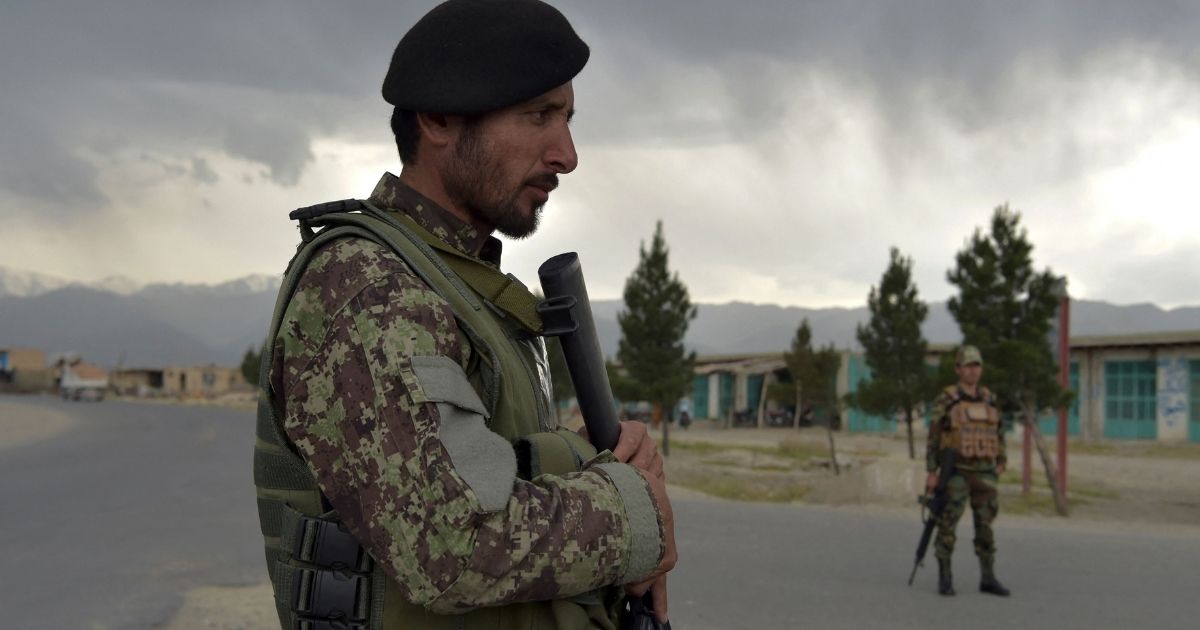 Afghan National Army soldiers stand guard at a checkpoint near a US military base in Bagram, Afghanistan, on April 29, 2021.