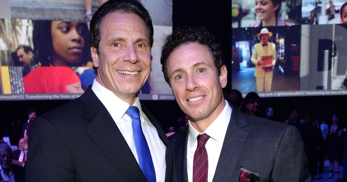 Democratic New York Gov. Andrew Cuomo and CNN host Chris Cuomo attend The Robin Hood Foundation's 2015 Benefit at Jacob Javitz Center on May 12, 2015, in New York City.