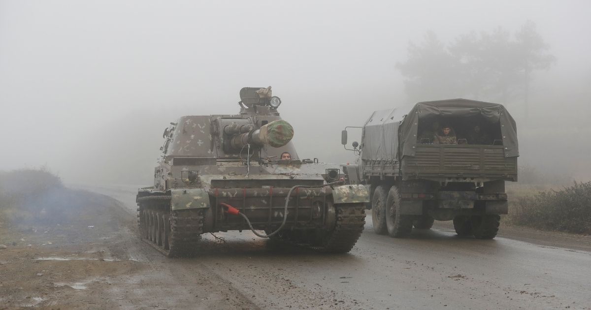 An Armenian self-propelled artillery unit rolls on a road during the withdrawal of Armenian troops from the separatist region of Nagorno-Karabakh, on Nov. 18, 2020.
