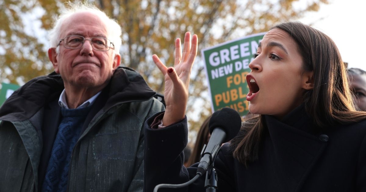 Vermont independent Sen. Bernie Sanders, left, and New York Democratic Rep. Alexandria Ocasio-Cortez hold a news conference to introduce legislation to transform public housing as part of their Green New Deal proposal outside the U.S. Capitol on Nov. 14, 2019, in Washington, D.C.