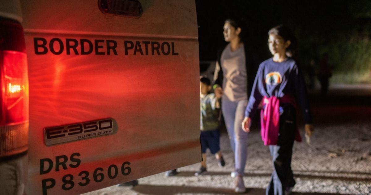 A group of Venezuelan immigrants is taken into U.S. Border Patrol custody on May 19, 2021, in Del Rio, Texas.