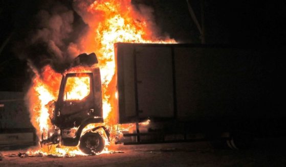 A truck burns at the entrance of the mixed Jewish-Arab city of Lod, where a state of emergency has been declared following civil unrest, on Wednesday.