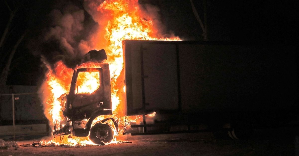A truck burns at the entrance of the mixed Jewish-Arab city of Lod, where a state of emergency has been declared following civil unrest, on Wednesday.