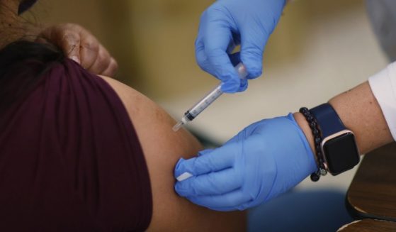 A Moderna COVID-19 vaccine is administered at a clinic set up by Healthcare Network on May 20, 2021, in Immokalee, Florida.