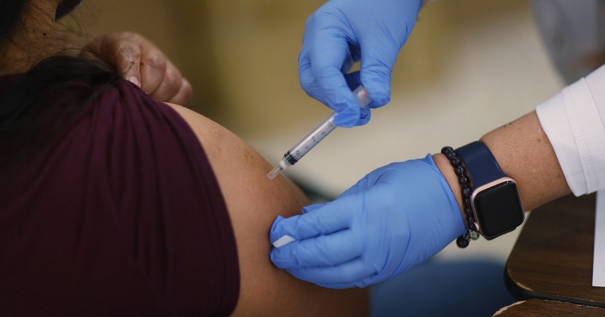 A Moderna COVID-19 vaccine is administered at a clinic set up by Healthcare Network on May 20, 2021, in Immokalee, Florida.