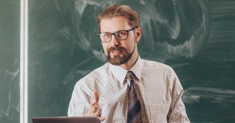 A college professor is pictured lecturing in the stock image above.