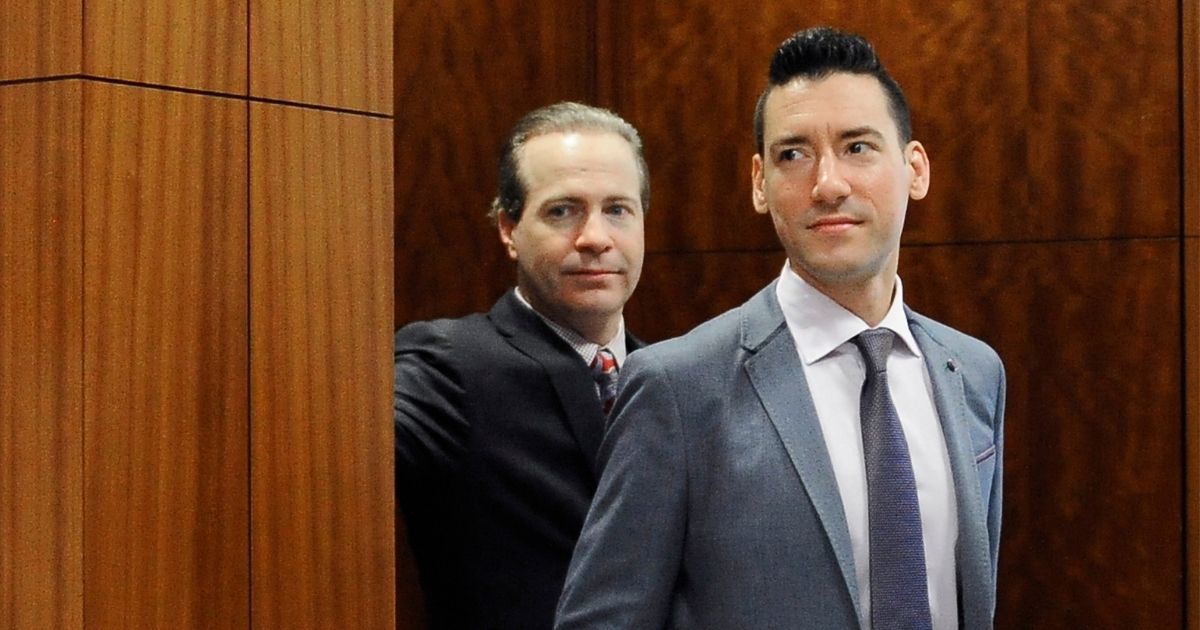 David Robert Daleiden, right, with attorney Jared Woodfill leaves a courtroom after a hearing in Houston on April 29, 2016.