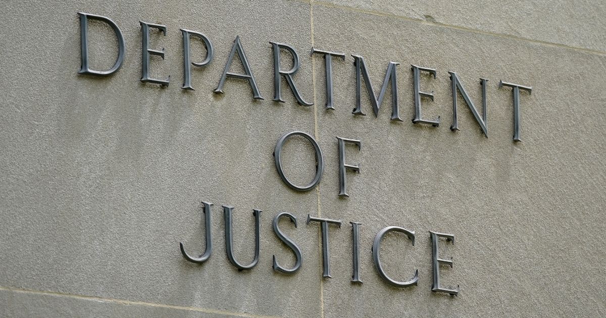A sign outside the Robert F. Kennedy Department of Justice building in Washington, D.C., is pictured above.