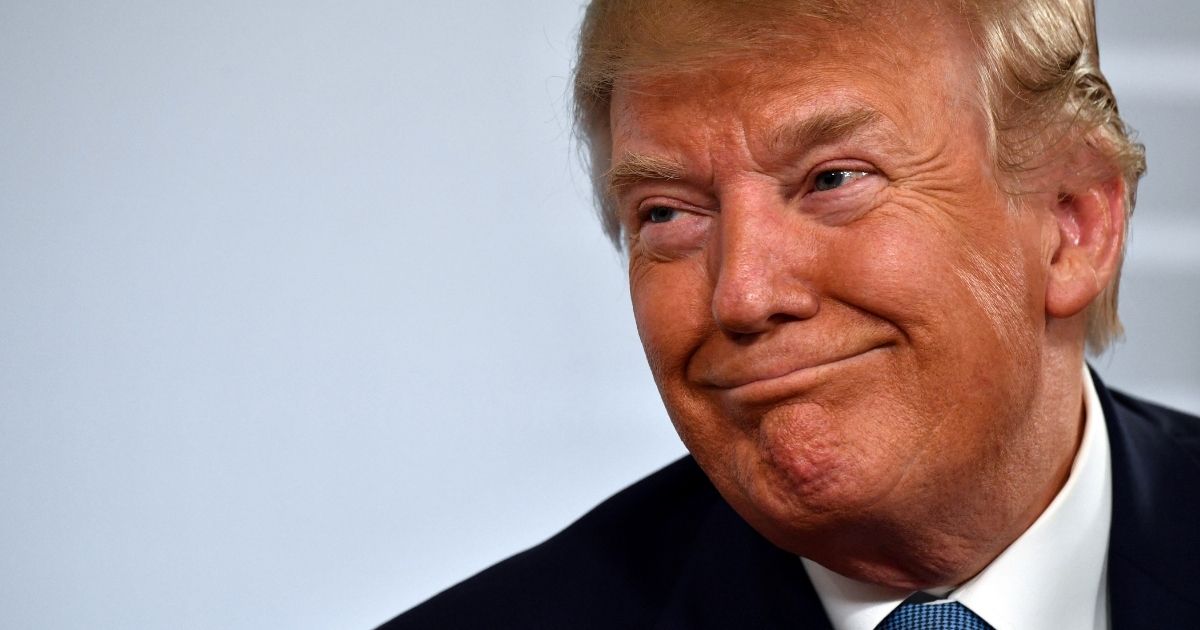 Then-President Donald Trump smiles during the G-7 summit in Biarritz, France, on Aug. 25, 2019.