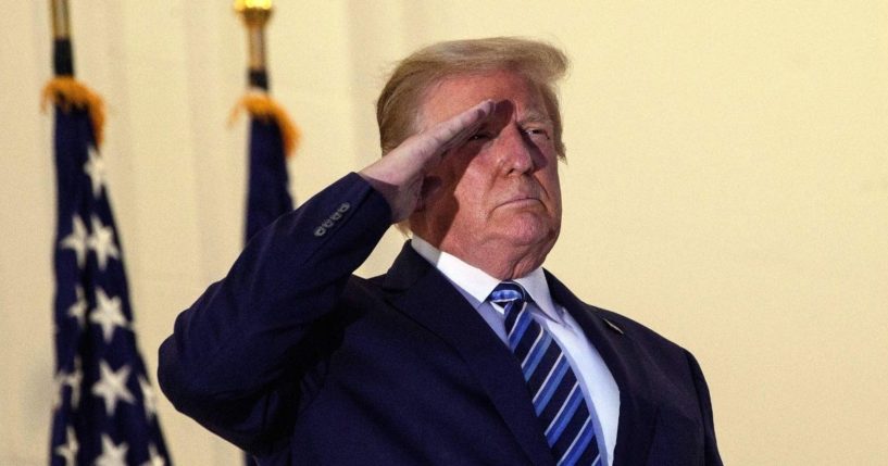 Then-President Donald Trump salutes from the Truman Balcony upon his return to the White House from Walter Reed Medical Center, where he underwent treatment for COVID-19, in Washington, D.C., on Oct. 5, 2020.