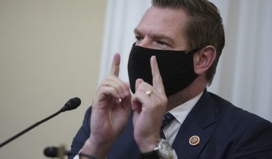 Democratic Eric Swalwell of California wears a protective mask while speaking during a House Intelligence Committee hearing on April 15 in Washington, D.C.