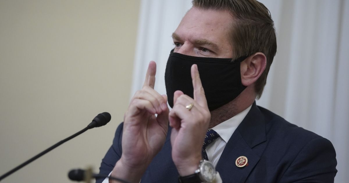 Democratic Eric Swalwell of California wears a protective mask while speaking during a House Intelligence Committee hearing on April 15 in Washington, D.C.