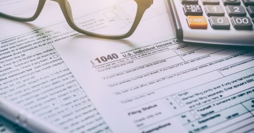 An IRS Form 1040 is pictured in the stock image above.