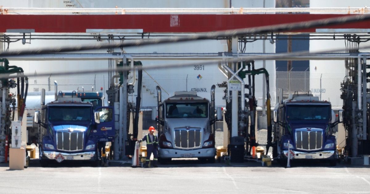 Fuel trucks fill their tanks at a fuel terminal on April 29, 2021, in Richmond, California.